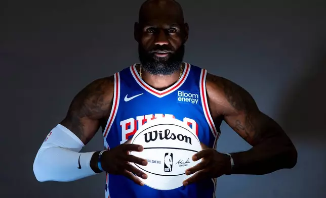 Philadelphia 76ers' LeBron James poses for photos during the NBA basketball team's media day, Monday, Sept. 28, 2026, in Camden, N.J.. (AP Photo/Chris Szagola)