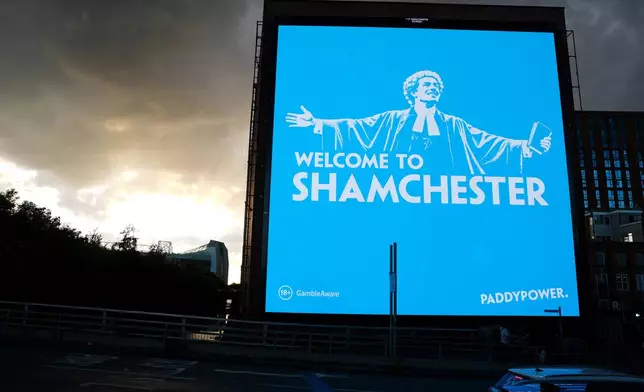 A general view of a billboard featuring a Paddy Power advert that reads 'Shamchester', in Manchester, England, Wednesday, Sept. 30, 2026. (Martin Rickett/PA via AP)