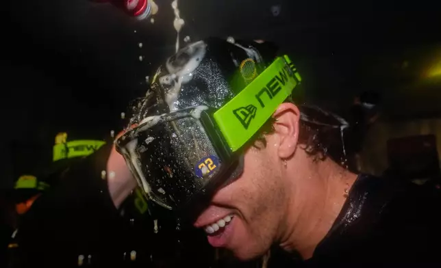 Milwaukee Brewers designated hitter Christian Yelich celebrates with teammates after winning baseball's World Series, against the Tampa Bay Rays, Wednesday, Oct. 28, 2026, in St. Petersburg, Fla. (AP Photo/Chris O'Meara)