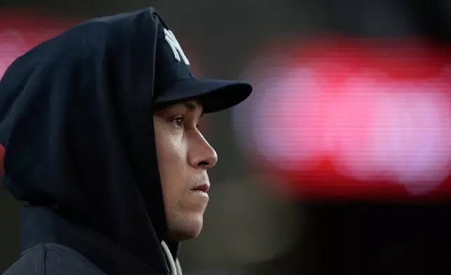 New York Yankees' Aaron Judge looks on from the dugout during the second inning in Game 1 of baseball's American League Wild Card Series against the Boston Red Sox, Tuesday, Sept. 29, 2026, in New York. (AP Photo/Yuki Iwamura)