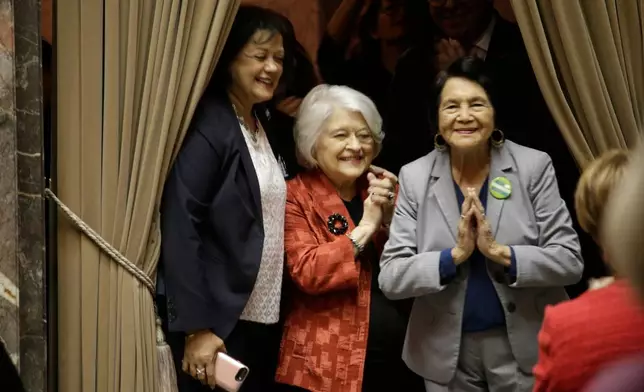 FILE - Dolores Huerta, far right, thanks senators after the unanimous vote to designate April 10 as "Dolores Huerta Day," March 18, 2019, in Olympia, Wash. (AP Photo/Rachel La Corte, File)