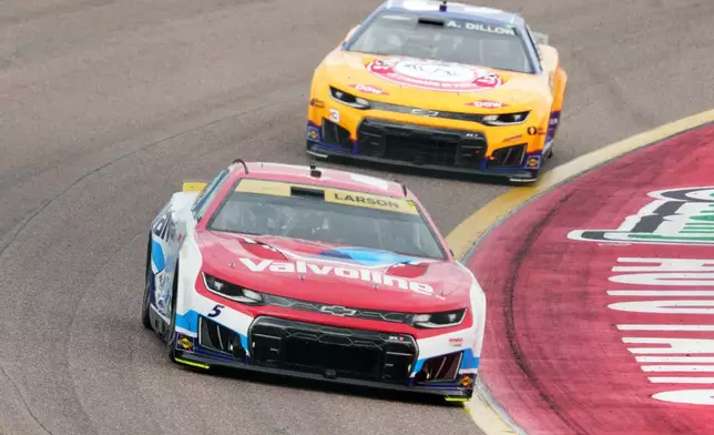 Kyle Larson (5) leads Austin Dillon on the 12th lap during a NASCAR Cup Series auto race Sunday, Oct. 18, 2026, in Avondale, Ariz. (AP Photo/Rick Scuteri)