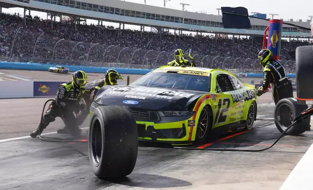 Ryan Blaney makes a pit stop on lap 128 during a NASCAR Cup Series auto race Sunday, Oct. 18, 2026, in Avondale, Ariz. (AP Photo/Rick Scuteri)