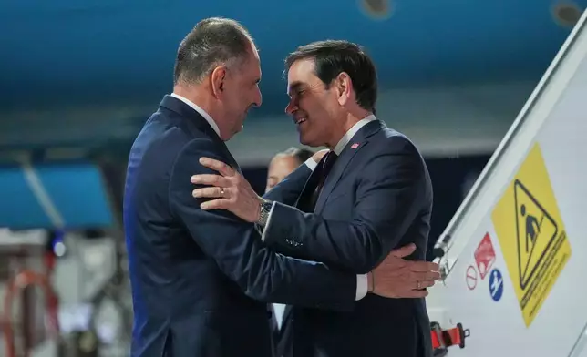 Greek Foreign Minister George Gerapetritis welcomes U.S. Secretary of State Marco Rubio, right, upon his arrival at Eleftherios Venizelos International Airport near Athens, Greece, Tuesday, Oct. 6, 2026. (AP Photo/Mark Schiefelbein, Pool)
