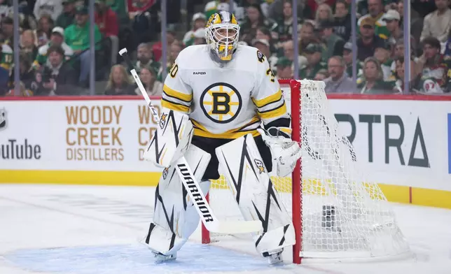 Boston Bruins goaltender Michael DiPietro focuses on the play during the first period of an NHL hockey game against the Minnesota Wild, Saturday, Oct. 3, 2026, in St. Paul, Minn. (AP Photo/Bailey Hillesheim)