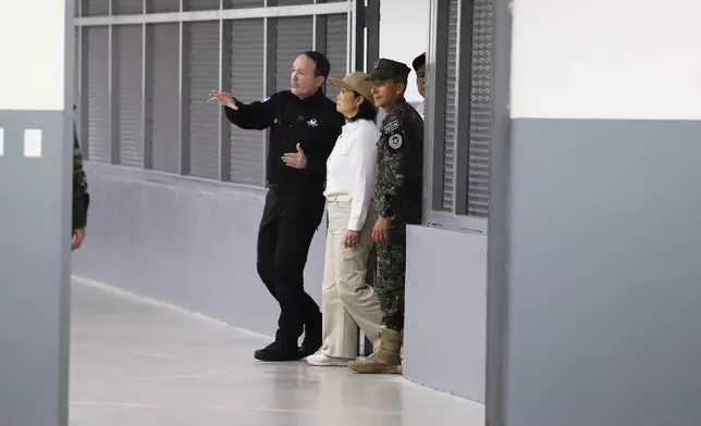 Peru's President Keiko Fujimori, center, tours the mega-prison known as the Terrorism Confinement Center (CECOT) in Tecoluca, El Salvador, Thursday, Oct. 29, 2026. (AP Photo/Salvador Melendez)
