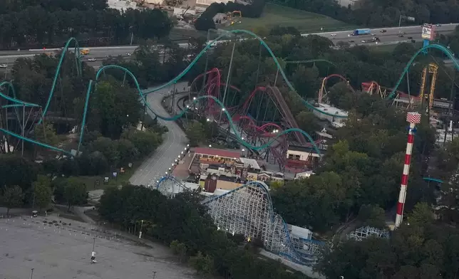 Attractions are seen at Six Flags Over Georgia, about 15 miles (24 kilometers) northwest of Atlanta, Thursday, Oct. 15, 2026, in Mableton. (AP Photo/Mike Stewart)