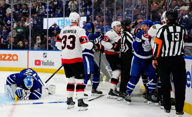 Toronto Maple Leafs goaltender Sergei Bobrovsky (72) reacts as Ottawa Senators and Maple Leafs players rough it up after the whistle during the third period of an NHL hockey game in Toronto, Saturday, Oct. 3, 2026. (Frank Gunn/The Canadian Press via AP)
