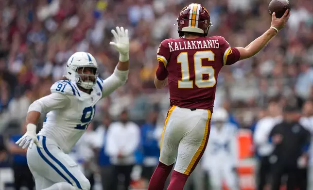 Indianapolis Colts defensive end Jaylahn Tuimoloau (91) puts pressure on a pass by Washington Commanders quarterback Athan Kaliakmanis (16) during an NFL football game in London, Sunday, Oct. 4, 2026. (AP Photo/David J. Phillip)