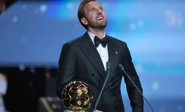 England's soccer player Harry Kane wins the player of the year trophy during the Ballon d'Or ceremony at the London Palladium Theatre in London, England, Monday, Oct. 26, 2026 . (AP Photo/Kin Cheung)