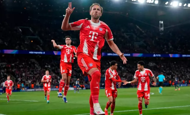 FILE - Bayern's Harry Kane celebrates after scoring a penalty, the opening goal of his team during the Champions League semifinal first leg soccer match between Paris Saint-Germain and Bayern Munich in Paris, Tuesday, April 28, 2026. (AP Photo/Christophe Ena, File)