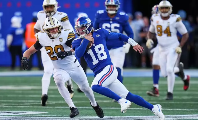 New York Giants quarterback J.J. McCarthy (18) runs the ball during the second half of an NFL football game against the New Orleans Saints in East Rutherford, N.J., Sunday, Oct. 18, 2026. (AP Photo/Frank Franklin II)