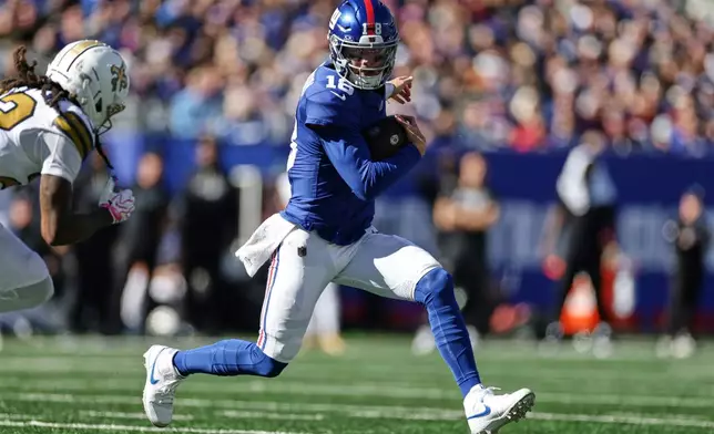 New York Giants quarterback J.J. McCarthy (18) runs the ball during the first half of an NFL football game against the New Orleans Saints in East Rutherford, N.J., Sunday, Oct. 18, 2026. (AP Photo/Adam Hunger)