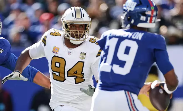 New Orleans Saints linebacker Cameron Jordan (94) looks to defend New York Giants quarterback Jameis Winston (19) during the second half of an NFL football game in East Rutherford, N.J., Sunday, Oct. 18, 2026. (AP Photo/Adam Hunger)