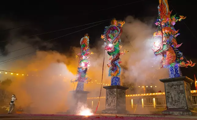 Devotees light giant Taoist joss stick during celebrations of the Nine Emperor Gods Festival in Kuala Pilah, Malaysia on Saturday, Oct. 17, 2026. (AP Photo/Anton L. Delgado)