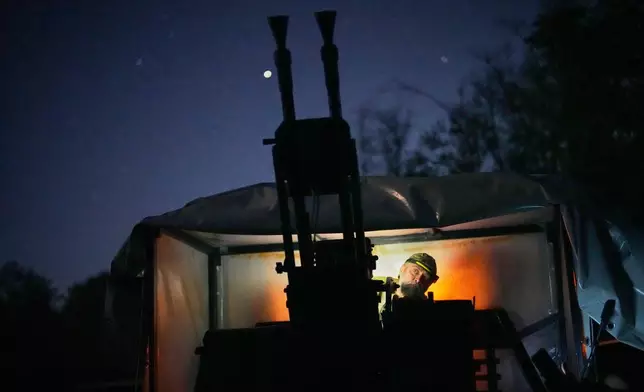 A Ukrainian air defense soldier gets ready to repel Russia's drone attack in Kyiv, Ukraine, Saturday evening, Sept. 19, 2026. (AP Photo/Efrem Lukatsky)