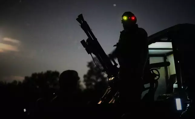 A Ukrainian air defense soldier gets ready to repel Russia's drone attack in Kyiv, Ukraine, Saturday evening, Sept. 19, 2026. (AP Photo/Efrem Lukatsky)