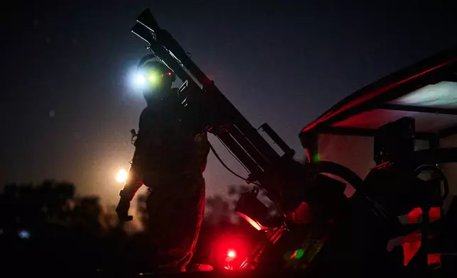 A Ukrainian air defense soldier gets ready to repel Russia's drone attack in Kyiv, Ukraine, Saturday evening, Sept. 19, 2026. (AP Photo/Efrem Lukatsky)