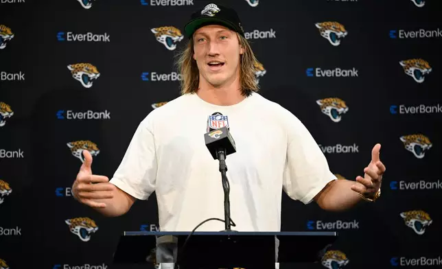 Jacksonville Jaguars quarterback Trevor Lawrence (16) speaks in a press conference after an NFL football game against the New England Patriots in Jacksonville, Fla., Sunday, Sept. 27, 2026. (AP Photo/Phelan M. Ebenhack)