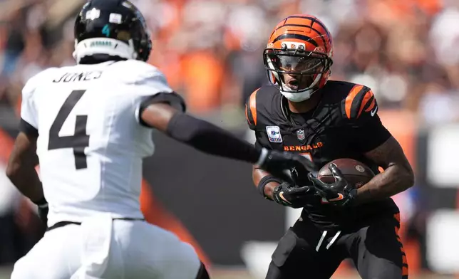 Cincinnati Bengals wide receiver Ja'marr Chase (1) runs the ball during an NFL football game against the Jacksonville Jaguars in Cincinnati, Sunday, Oct. 4, 2026. (AP Photo/Joshua A. Bickel)