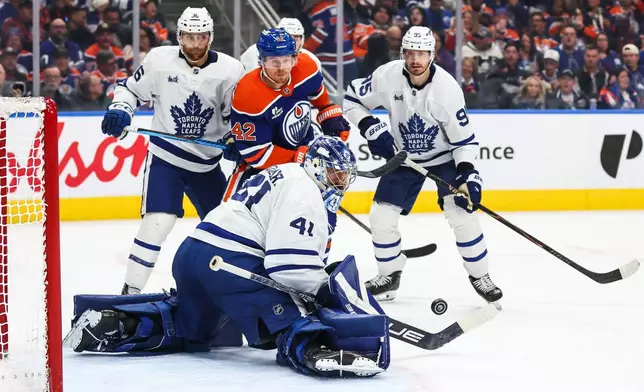 Edmonton Oilers' Kasperi Kapanen (42) watches Toronto Maple Leafs goaltender Anthony Stolarz (41) make a save during the second period of an NHL hockey game in Edmonton, Alberta, Saturday, Oct. 24, 2026. (Codie McLachlan/The Canadian Press via AP)