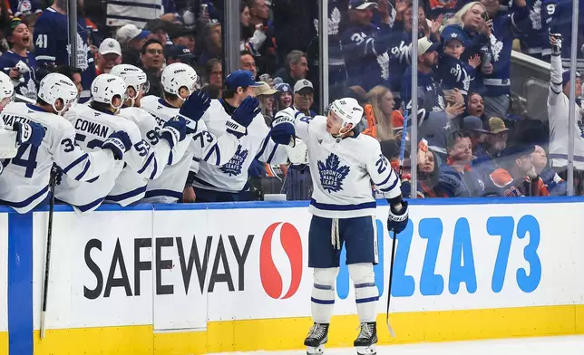 Toronto Maple Leafs' Troy Stecher (28) celebrates after a goal against the Edmonton Oilers during the second period of an NHL hockey game in Edmonton, Alberta, Saturday, Oct. 24, 2026. (Codie McLachlan/The Canadian Press via AP)