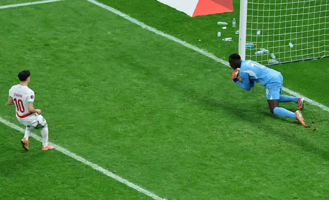 FILE - Senegal's goalkeeper Edouard Osoque Mendy saves a penalty from Morocco's Brahim Abdelkader Díaz during the Africa Cup of Nations final soccer match between Senegal and Morocco in Rabat, Morocco, Jan. 18, 2026. (AP Photo/Youssef Loulidi, File)