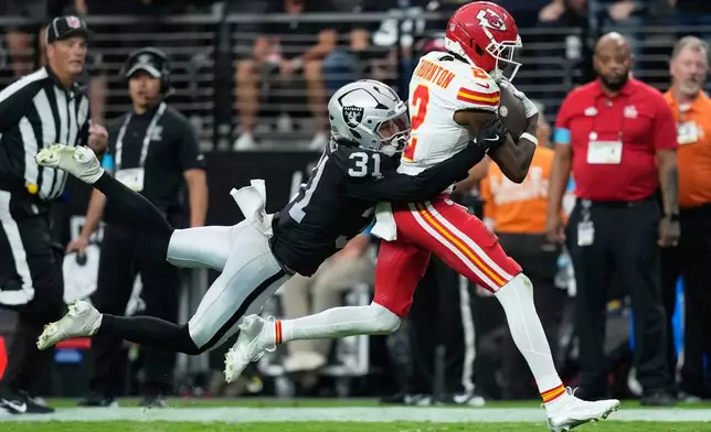 Las Vegas Raiders safety Treydan Stukes (31) tackles Kansas City Chiefs wide receiver Tyquan Thornton (2) during the second half of an NFL football game in Las Vegas, Sunday, Oct. 4, 2026. (AP Photo/John Locher)