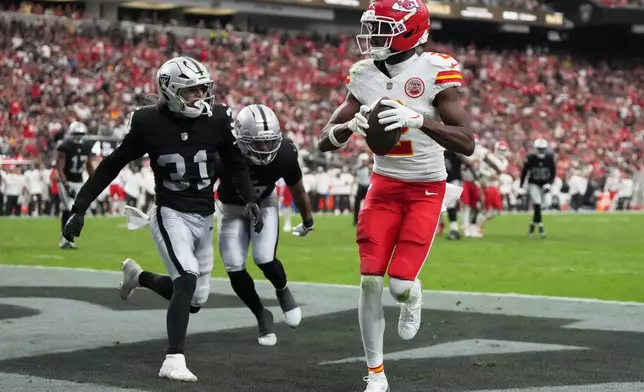 Kansas City Chiefs wide receiver Tyquan Thornton (2) scores a touchdown past Las Vegas Raiders safety Treydan Stukes (31) during the second half of an NFL football game in Las Vegas, Sunday, Oct. 4, 2026. (AP Photo/Rick Scuteri)