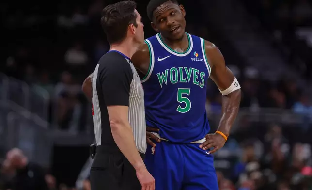 Minnesota Timberwolves' guard Anthony Edwards (5) reacts during a preseason NBA basketball game against the Milwaukee Bucks, Monday, Oct. 5, 2026, in Milwaukee. (AP Photo/Kylie Bridenhagen)