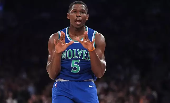 Minnesota Timberwolves' Anthony Edwards (5) gestures after making a three-point shot during the first half of a preseason NBA basketball game against the New York Knicks Monday, Oct. 12, 2026, in New York. (AP Photo/Frank Franklin II)