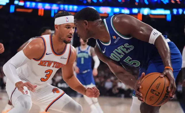 New York Knicks' Josh Hart (3) defends Minnesota Timberwolves' Anthony Edwards (5) during the first half of a preseason NBA basketball game Monday, Oct. 12, 2026, in New York. (AP Photo/Frank Franklin II)