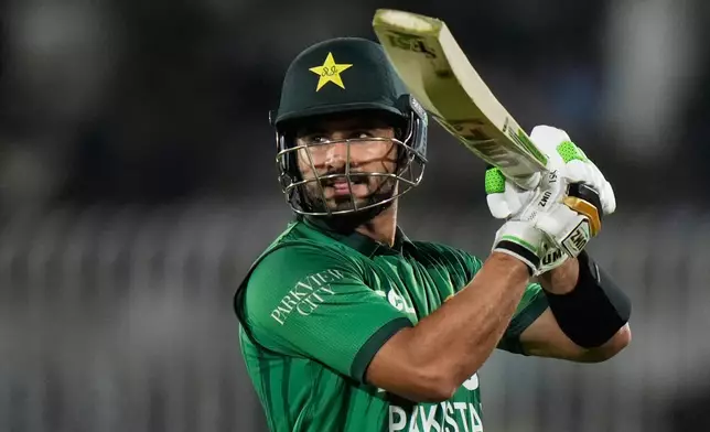 Pakistan's captain Sahibzada Farhan leaves the ground after losing his wicket during the second T20 cricket match between Pakistan and Sri Lanka, in Rawalpindi, Pakistan, Sunday, Oct. 11, 2026. (AP Photo/Anjum Naveed)