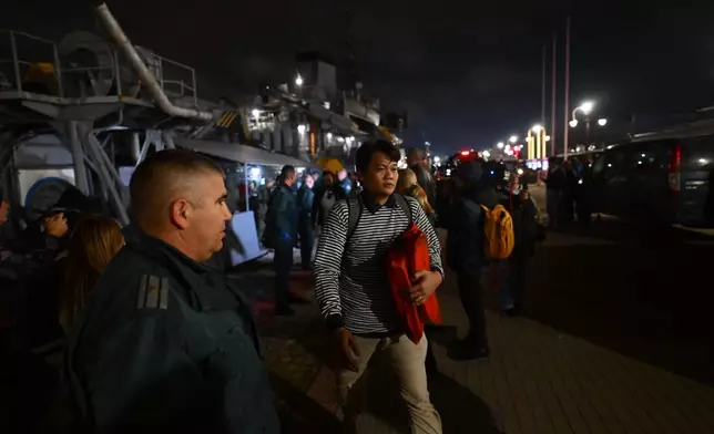 A crew member of the Liberian-flagged container ship Contship Jet, which was attacked by drones, is evacuated and transported to the port of Varna, Bulgaria, aboard the Bulgarian Navy rescue ship "Proteo", late Wednesday, Oct. 28, 2026. (AP Photo/Petko Momchilov)