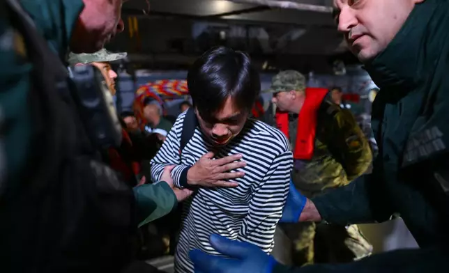 A crew member of the Liberian-flagged container ship Contship Jet, which was attacked by drones, is evacuated and transported to the port of Varna, Bulgaria, aboard the Bulgarian Navy rescue ship "Proteo", late Wednesday, Oct. 28, 2026. (AP Photo/Petko Momchilov)