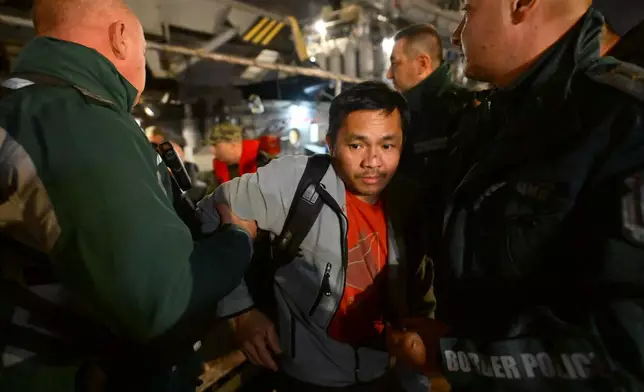 A crew member of the Liberian-flagged container ship Contship Jet, which was attacked by drones, is evacuated and transported to the port of Varna, Bulgaria, aboard the Bulgarian Navy rescue ship "Proteo", late Wednesday, Oct. 28, 2026. (AP Photo/Petko Momchilov)