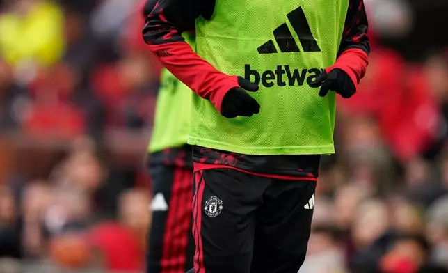 Manchester United's Bruno Fernandes warms up during the English Premier League soccer match between Manchester United and Bournemouth in Manchester, England, Sunday, Oct. 25, 2026. (AP Photo/Dave Thompson)