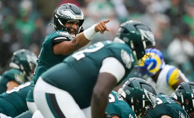 Philadelphia Eagles quarterback Jalen Hurts (1) gestures during the second half of an NFL football game against the Los Angeles Rams in Philadelphia, Sunday, Oct. 4, 2026. (AP Photo/Matt Slocum)
