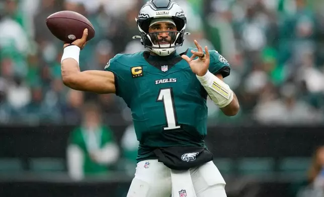 Philadelphia Eagles quarterback Jalen Hurts looks to pass during the second half of an NFL football game against the Los Angeles Rams in Philadelphia, Sunday, Oct. 4, 2026. (AP Photo/Matt Slocum)