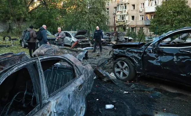 Cars are seen damaged by a Russian strike on residential neighbourhood in Zaporizhzhia, Ukraine, Friday, Oct. 9, 2026. (AP Photo/Kateryna Klochko)