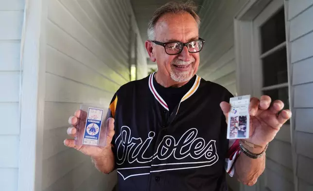 Baltimore Orioles fan Rick Taylor holds two newly-acquired tickets to add to his collection of tickets from almost every baseball game of Cal Ripken Jr.'s 2,632 game "Iron Man" streak, at his home in Reisterstown, Md., Tuesday, Oct. 13, 2026. (AP Photo/Stephanie Scarbrough)