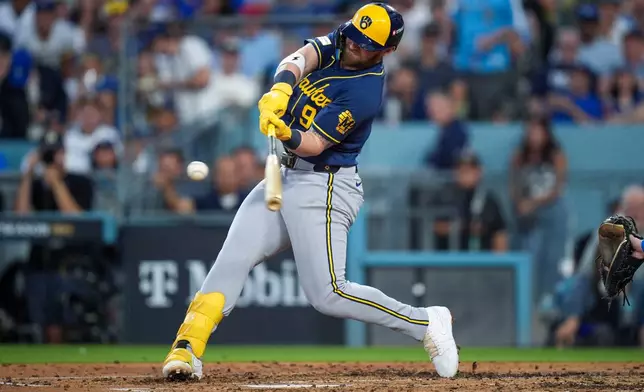 Milwaukee Brewers first baseman Jake Bauers connects for a two-RBI double during the fourth inning of Game 4 of baseball's National League Championship Series between the Milwaukee Brewers and the Los Angeles Dodgers, Thursday, Oct. 15, 2026, in Los Angeles. (AP Photo/Gregory Bull)