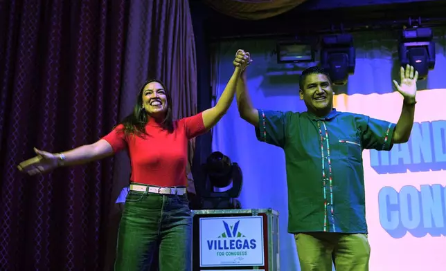 Rep. Alexandria Ocasio-Cortez, left, D-N.Y., and Randy Villegas, right, Democratic candidate for congress in California's 22nd District, wave at the end of a campaign rally, Friday, Oct. 23, 2026, in Bakersfield, Calif. (AP Photo/Jae C. Hong)