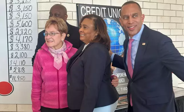 In this photo taken with a smartphone, House Democratic Leader Hakeem Jeffries, with Rep. Marcy Kaptur, D-Ohio, talk with people at the Friendship Baptist Church, on Oct. 18, 2026, in Toledo, Ohio. (AP Photo/Lisa Mascaro)