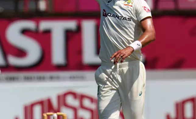 Australia's Mitchell Starc celebrates taking a wicket on day five of the first cricket test match between South Africa and Australia, in Durban, South Africa, Tuesday, Oct. 13, 2026. (AP Photo/Themba Hadebe)