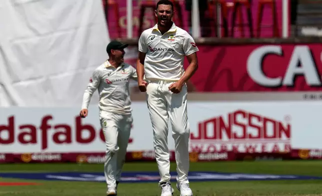 Australia's Josh Hazlewood celebrates after dismissing South Africa's Wiaan Mulder on day five of the first cricket test match between South Africa and Australia, in Durban, South Africa, Tuesday, Oct. 13, 2026. (AP Photo/Themba Hadebe)