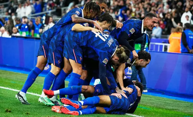 France players celebrate after France's Michael Olise scored his goal during the Nations League soccer match between France and Belgium in Saint-Denis near Paris, Monday, Oct. 5, 2026. (AP Photo/Teresa Suarez)