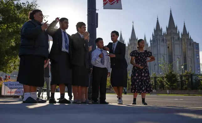 People look for tickets outside the Conference Center for the morning session of the 196th Semiannual General Conference of the Church of Jesus Christ of Latter-day Saints, Saturday, Oct. 3, 2026, in Salt Lake City. (Erin Hooley/The Deseret News via AP)