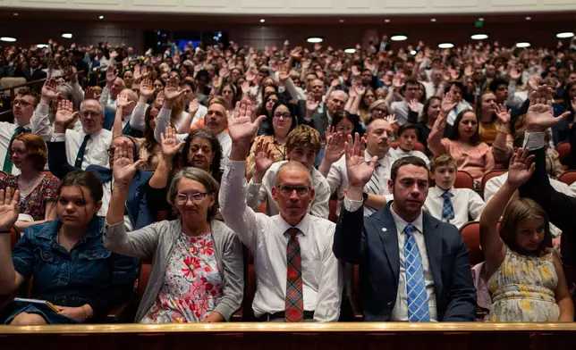 Conferencegoers give sustaining votes during the morning session of the 196th Semiannual General Conference of the Church of Jesus Christ of Latter-day Saints at the Conference Center in Salt Lake City on Saturday, Oct. 3, 2026. (Tess Crowley/The Deseret News via AP)