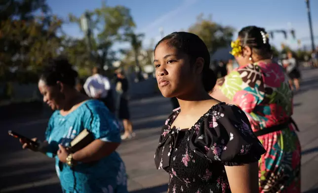 Jenesslee Aiono, 12, of Seattle, arrives at the Conference Center with her family for the morning session of the 196th Semiannual General Conference of the Church of Jesus Christ of Latter-day Saints, Saturday, Oct. 3, 2026, in Salt Lake City. (Erin Hooley/The Deseret News via AP)